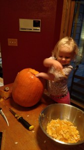 Allison loved digging the guts out of the pumpkins